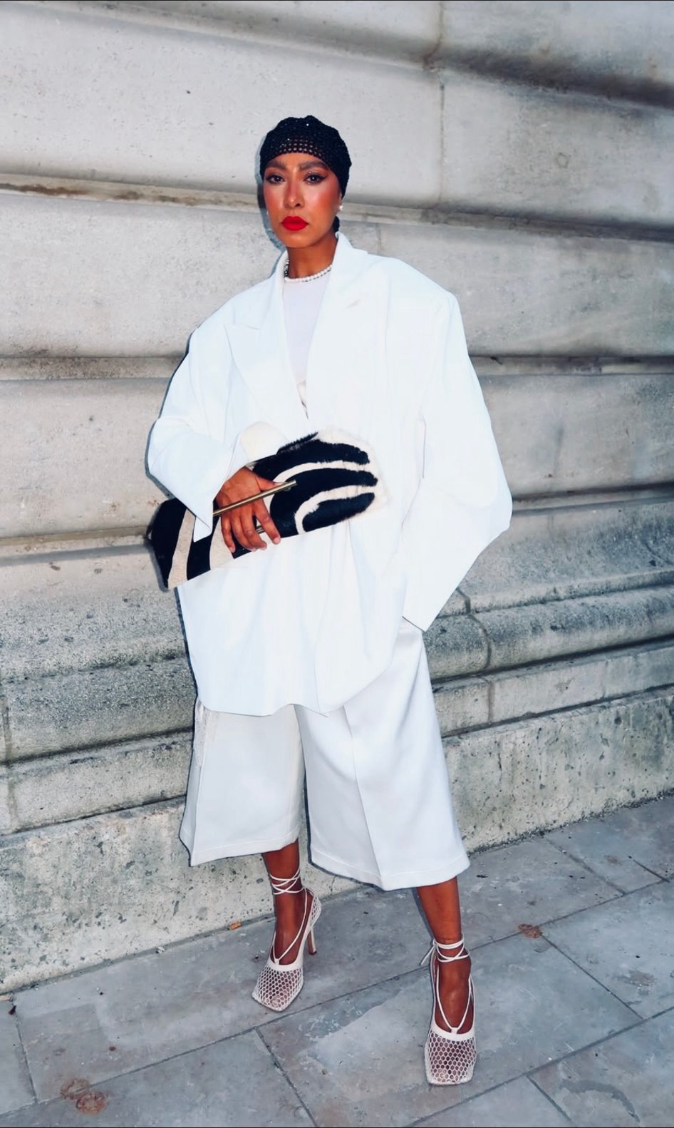 Paris — white standing with zebra clutch